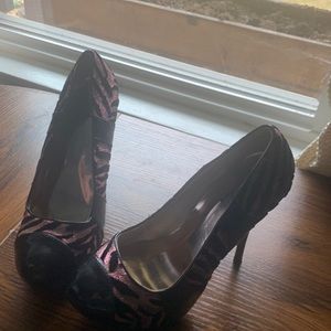 Tiger print, sparkling pink and black platform heal.